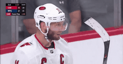 A Hockey Player With The Letter C On His Chest GIF
