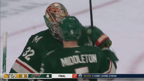 A Hockey Player With The Name Middleton On Their Back GIF