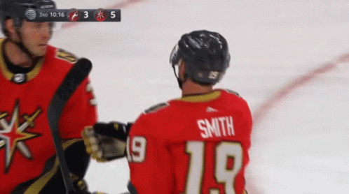 A Hockey Player With The Name Smith On His Back GIF