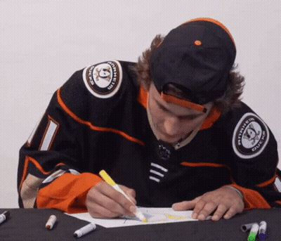 a hockey player with the number 1 on his jersey is drawing
