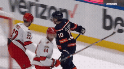 A Hockey Player With The Number 10 On The Back Of His Shirt GIF