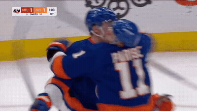 A Hockey Player With The Number 11 On His Back GIF
