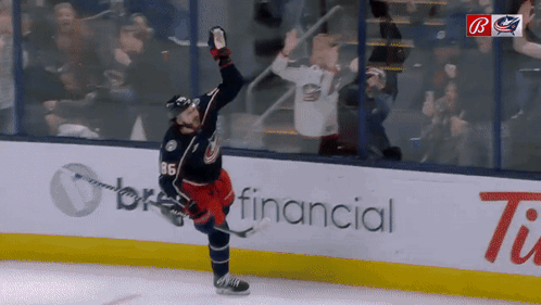 A Hockey Player With The Number 11 On His Jersey GIF