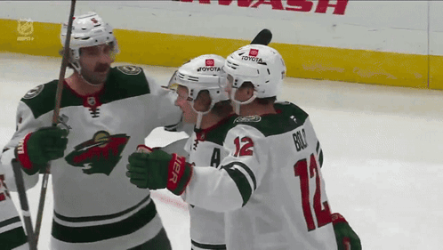 A Hockey Player With The Number 12 On His Back GIF