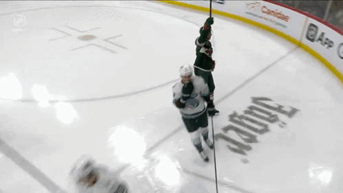 A Hockey Player With The Number 12 On His Back GIF