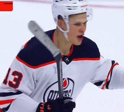 A Hockey Player With The Number 13 On His Shirt GIF