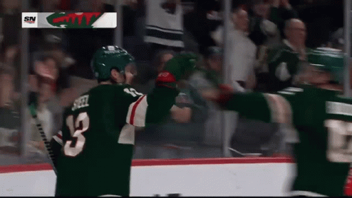 A Hockey Player With The Number 13 On Their Jersey GIF