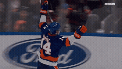 A Hockey Player With The Number 14 On His Jersey Is Celebrating GIF