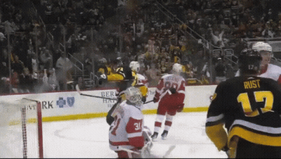 A Hockey Player With The Number 17 On His Jersey Stands On The Ice GIF