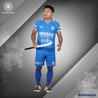 A Hockey Player With The Number 18 On His Shorts Is Holding A Stick GIF