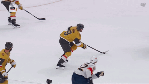 A Hockey Player With The Number 19 On His Jersey Lays On The Ice GIF