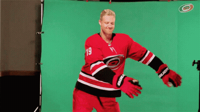 A Hockey Player With The Number 19 On His Shirt GIF
