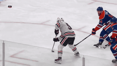 A Hockey Player With The Number 2 On His Jersey Is Playing On The Ice GIF