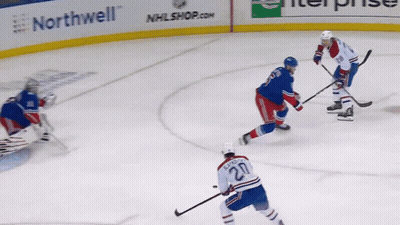 A Hockey Player With The Number 20 On His Back GIF