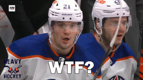 A Hockey Player With The Number 21 On His Helmet Looks At The Camera GIF