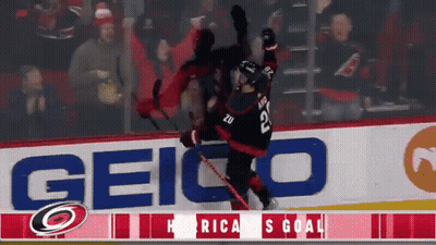 A Hockey Player With The Number 22 On His Jersey Is Falling GIF