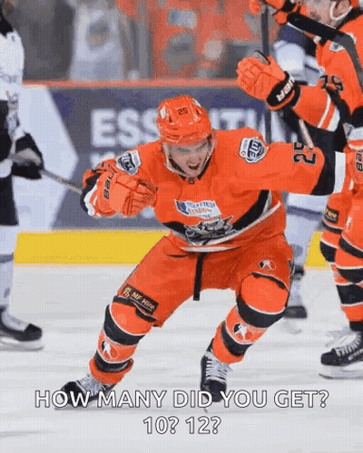A Hockey Player With The Number 22 On His Jersey Is Standing On The Ice GIF