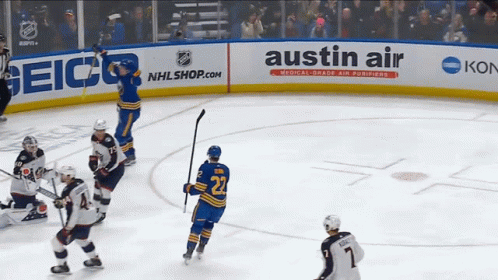 A Hockey Player With The Number 22 On Their Jersey GIF