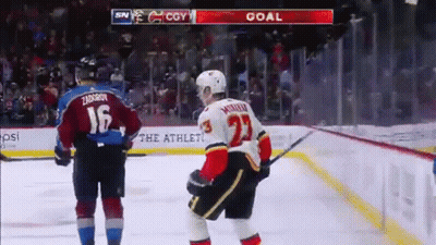 A Hockey Player With The Number 23 On His Back GIF