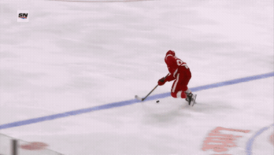 A Hockey Player With The Number 23 On His Jersey GIF