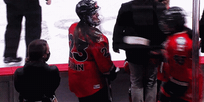 A Hockey Player With The Number 23 On The Back Of Their Jersey GIF