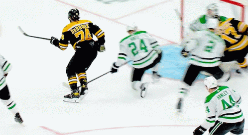 A Hockey Player With The Number 24 On His Jersey Is Skating On The Ice GIF