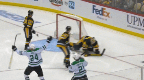 A Hockey Player With The Number 24 On His Jersey Stands On The Ice GIF