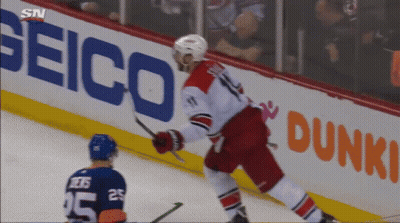A Hockey Player With The Number 25 On His Jersey Stands On The Ice GIF