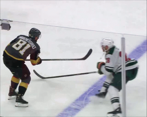 A Hockey Player With The Number 28 On His Jersey Is Laying On The Ice GIF