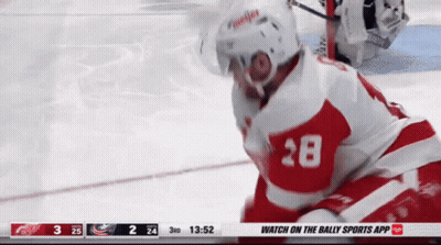 A Hockey Player With The Number 28 On His Jersey Is On The Ice GIF