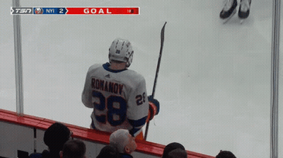 A Hockey Player With The Number 28 On His Jersey Stands On The Ice GIF