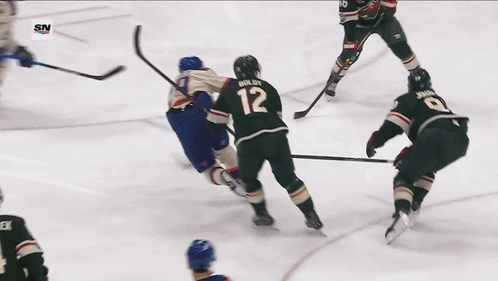 A Hockey Player With The Number 29 On His Jersey Is Holding A Hockey Stick GIF