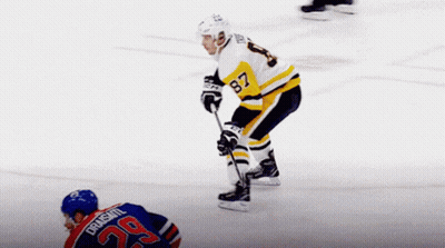 A Hockey Player With The Number 29 On His Jersey Stands On The Ice GIF