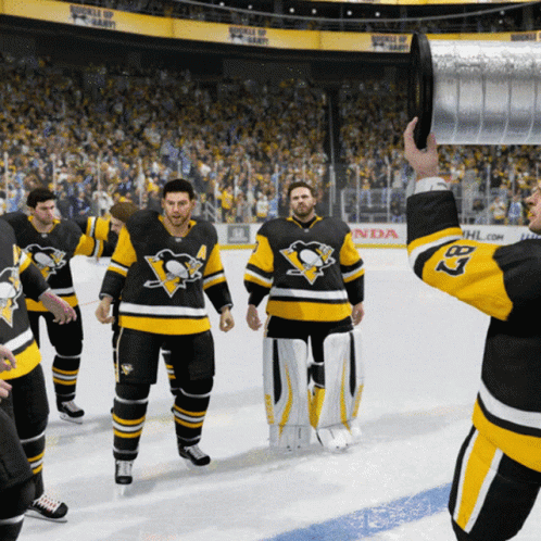 A Hockey Player With The Number 3 On His Jersey Holds A Trophy GIF