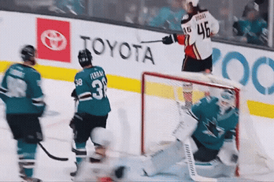 A Hockey Player With The Number 3 On His Jersey Stands On The Ice GIF
