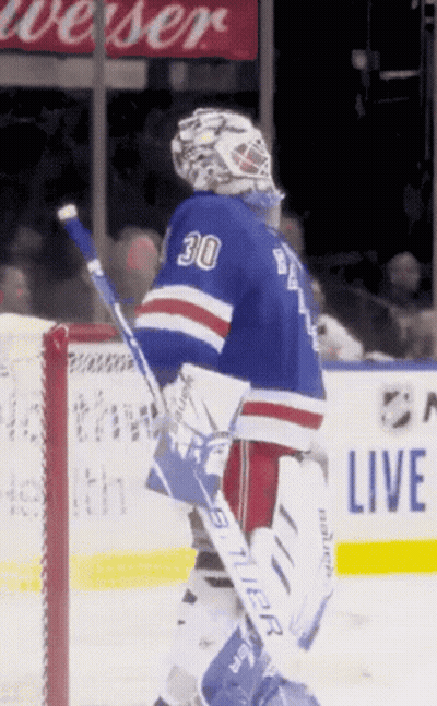 A Hockey Player With The Number 30 On His Jersey Stands On The Ice GIF