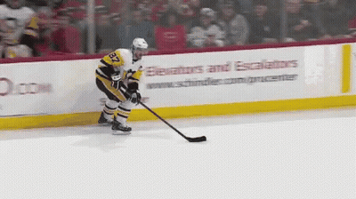 A Hockey Player With The Number 32 On His Jersey Stands On The Ice GIF
