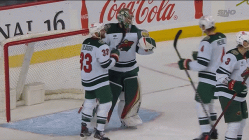 A Hockey Player With The Number 33 On His Jersey Stands On The Ice GIF
