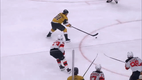 A Hockey Player With The Number 33 On His Shirt GIF