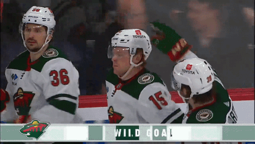 A Hockey Player With The Number 36 On His Jersey Stands Next To Another Player GIF