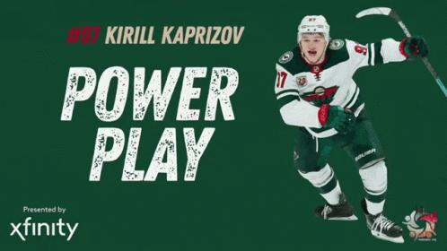 A Hockey Player With The Number 37 On His Jersey Is Holding A Hockey Stick GIF