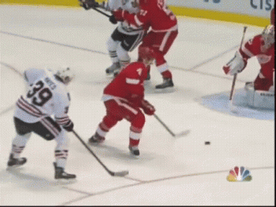 A Hockey Player With The Number 39 On His Jersey Stands On The Ice GIF