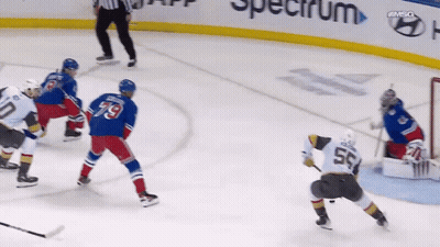A Hockey Player With The Number 55 On His Back GIF