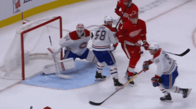A Hockey Player With The Number 58 On His Shirt GIF