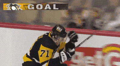 A Hockey Player With The Number 71 On His Jersey Is On The Ice GIF