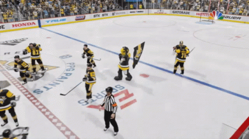 A Hockey Player With The Number 71 On His Jersey Is Surrounded By Other Players GIF
