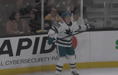 A Hockey Player With The Number 71 On His Jersey Stands On The Ice GIF