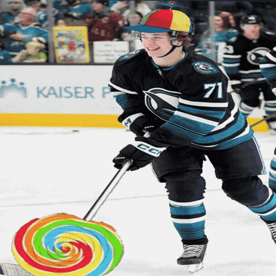 A Hockey Player With The Number 71 On Their Jersey GIF
