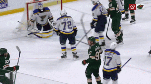 A Hockey Player With The Number 72 On His Back GIF