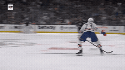 A Hockey Player With The Number 73 On His Back GIF